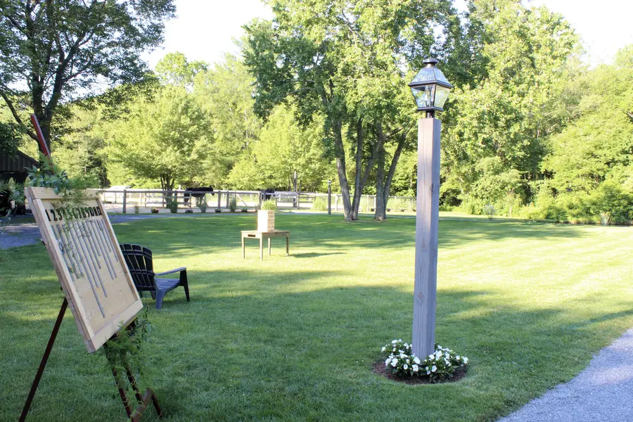 Lamp post and sign easel on the lawn