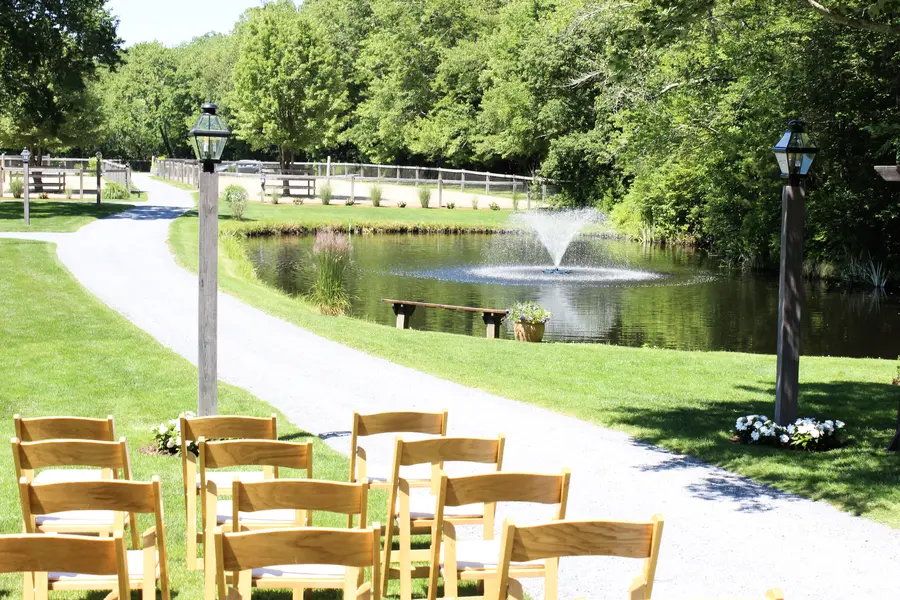 Ceremony chairs beside the pond
