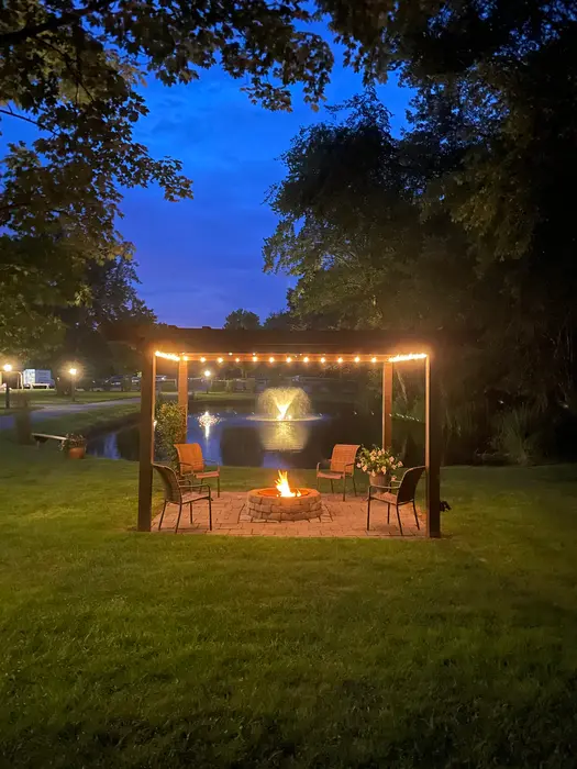 Fire pit by the pond at dusk
